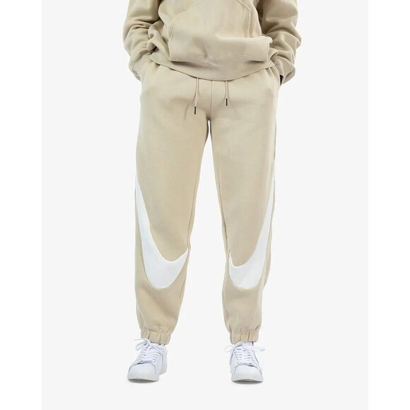 Nike NSW Swoosh Graphic Fleece Joggers in Beige - Picture 1 of 6